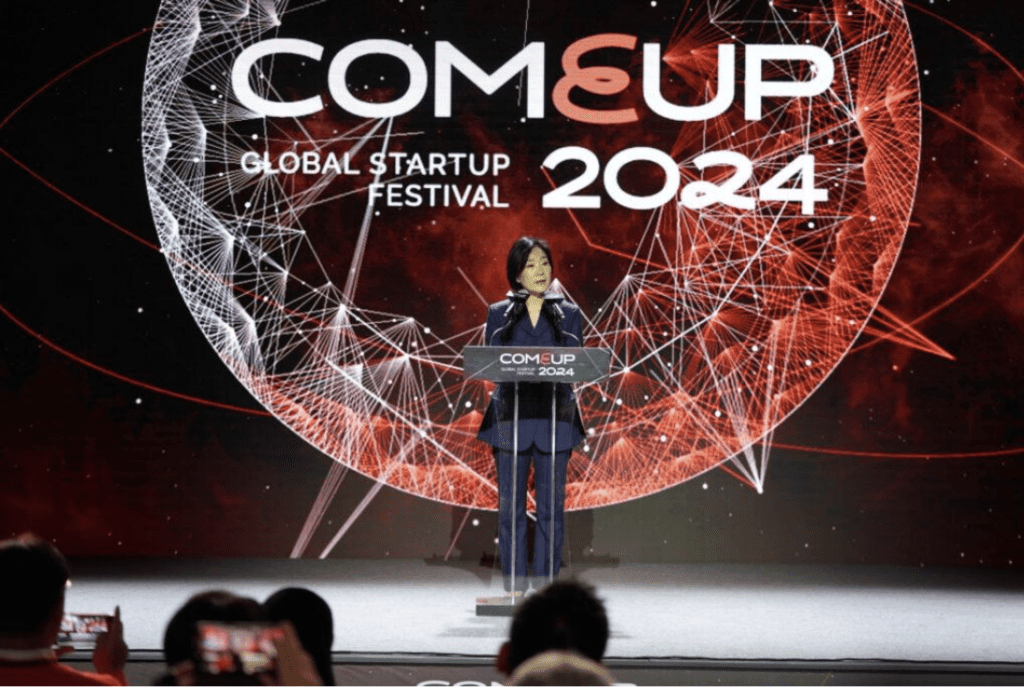 Minister of SMEs and Startups Oh Young-joo giving a congratulatory speech at the opening ceremony of COMEUP 2024