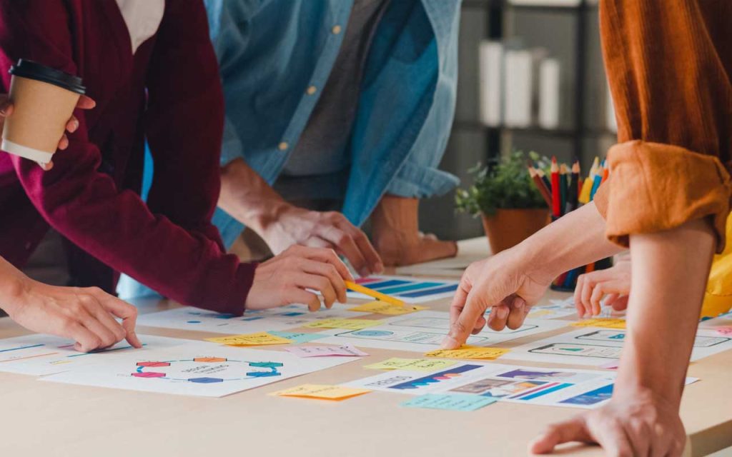 Illustration of team redesigning their workflow. | Stock Photos