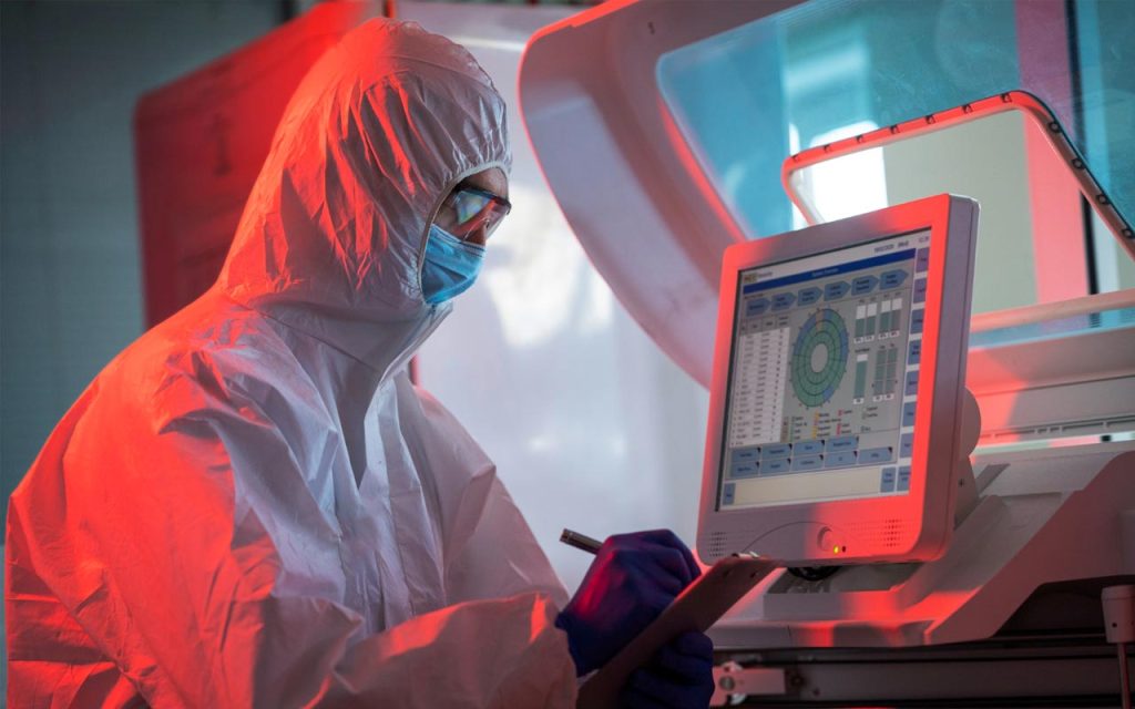 Illustration of healthtech worker conducting a test. | Stock Photos