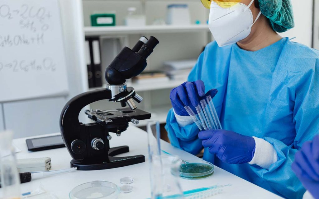 Illustration of a science researcher working on an experiment. | Stock Photos