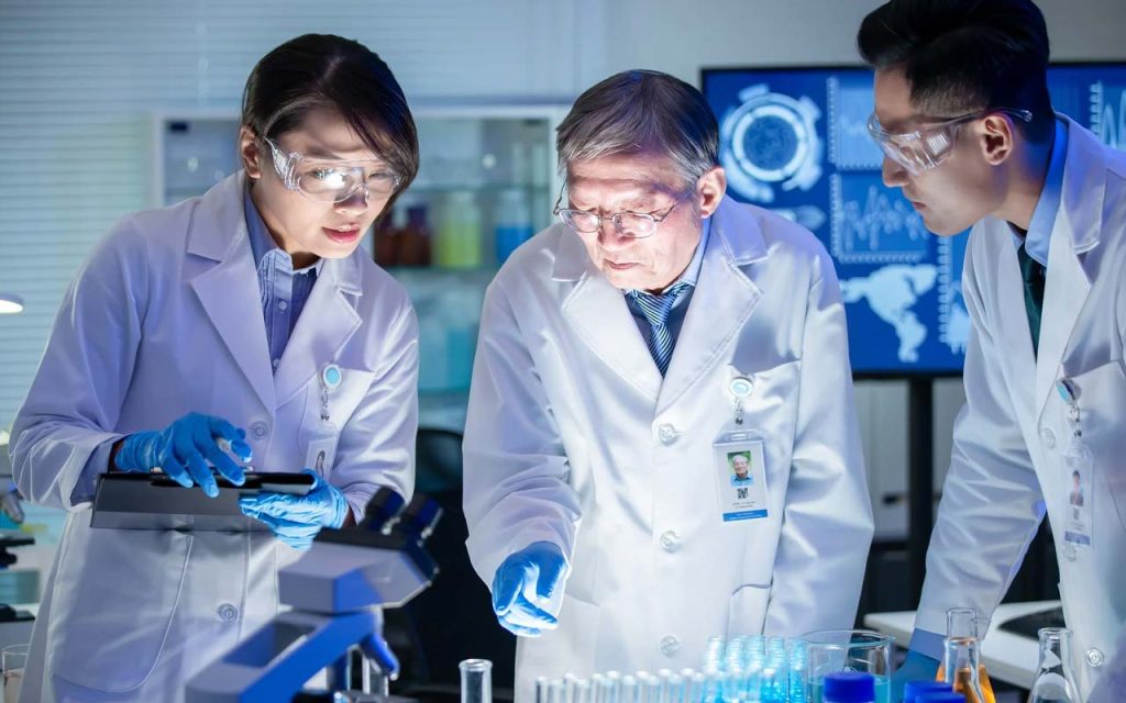 Illustration of a research team working on an experiment. | Stock Photos